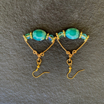 Earrings made of Turquoise Crystal Ovals with crystal rounds on Gold Geometric wire