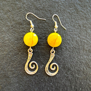 Earrings made of Yellow crystal rounds with silver swirl accent