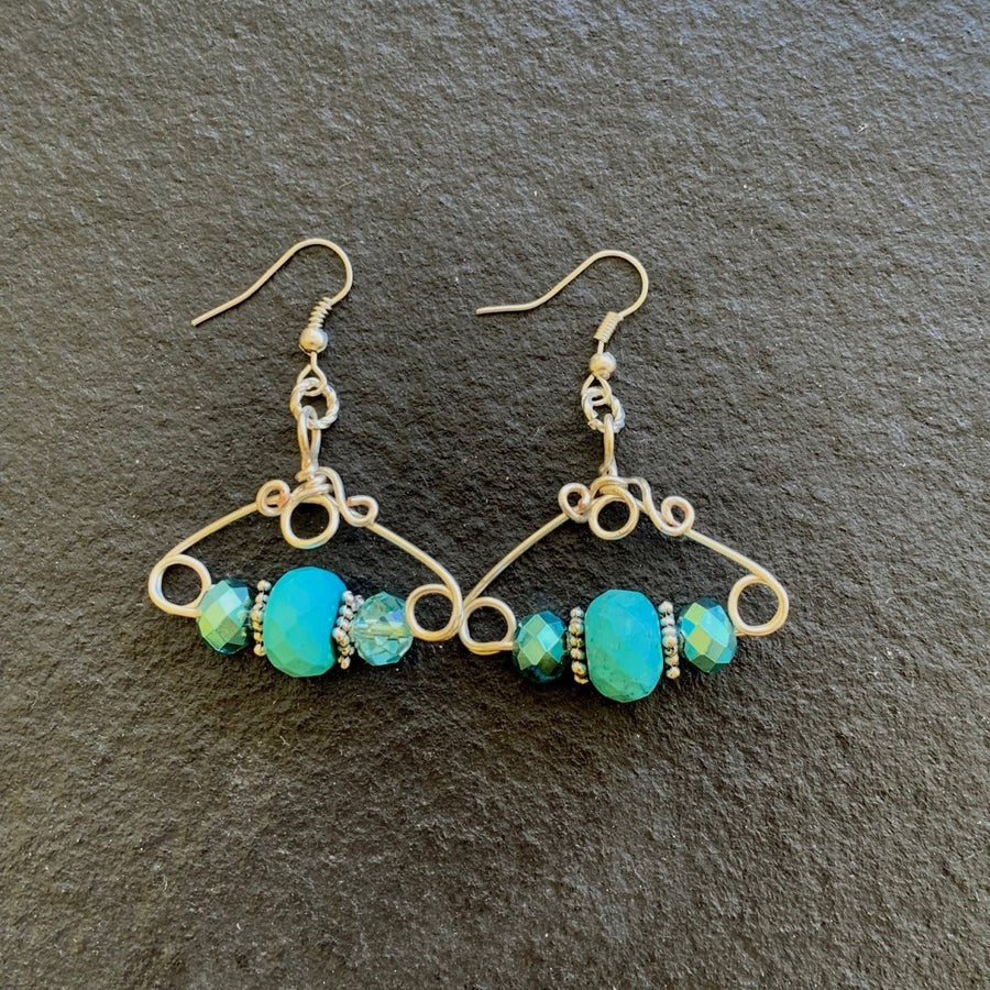 Earrings made of Large Turquoise Rondels with turquoise crystals on geometric silver wire