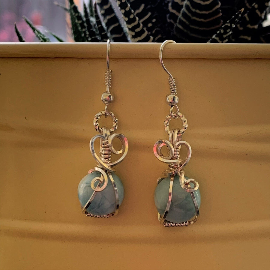 Earrings made of Larimar round stone with silver wrap