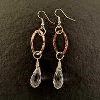 Earrings made of Silver hammered ovals with clear crystal briolettes