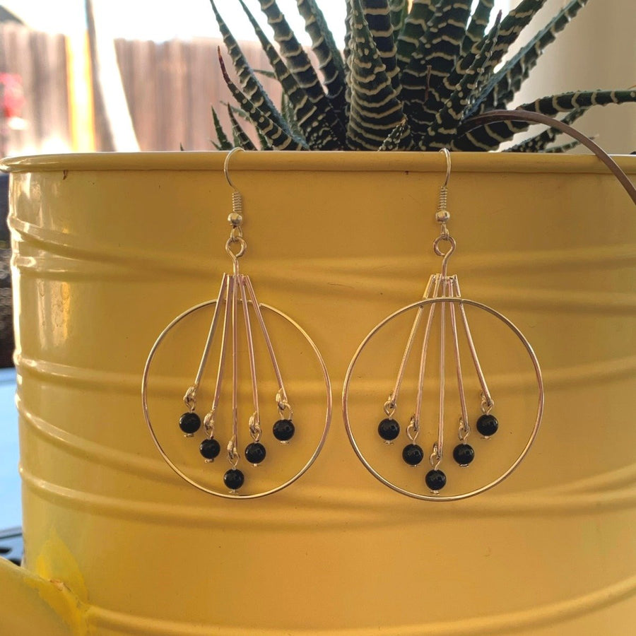 Earrings made of Silver hoops with black onyx beads