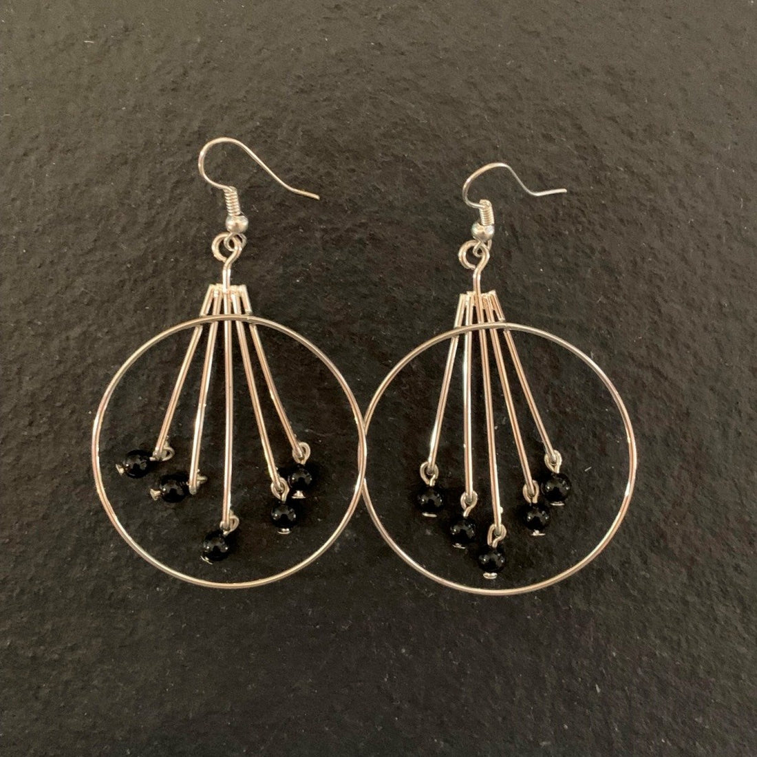 Earrings made of Silver hoops with black onyx beads