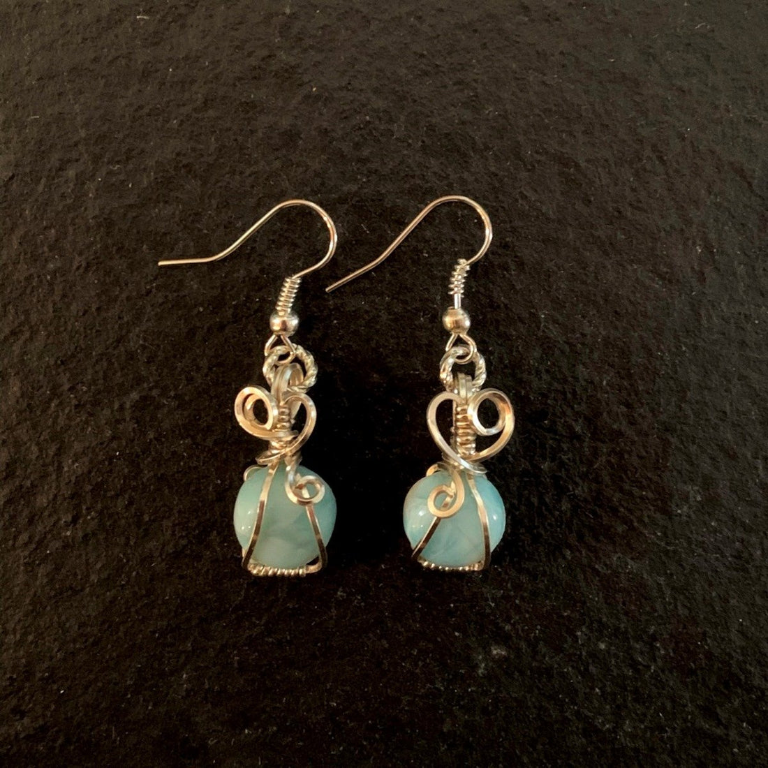 Earrings made of Round Larimar stones with silver wire wrap