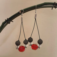 Earrings made of Red crystals on black cord with crystal rondels & antique silver beads