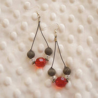 Earrings made of Red crystals on black cord with crystal rondels & antique silver beads