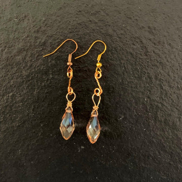 Earrings made of Peach crystal Briolettes with gold swirl