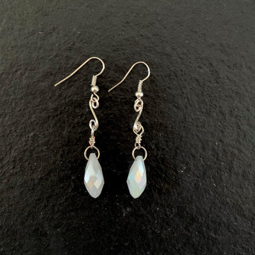 Earrings made of White crystal Briolettes with gold swirl