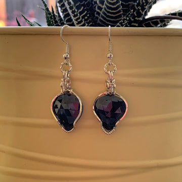 Earrings made of Rose Cut Blue Sapphires in silver wrap