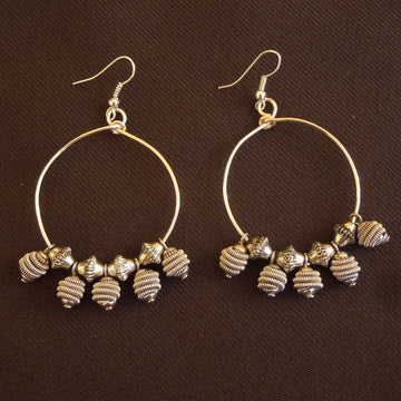 Earrings made of wire hoops with silver beads & dangles.