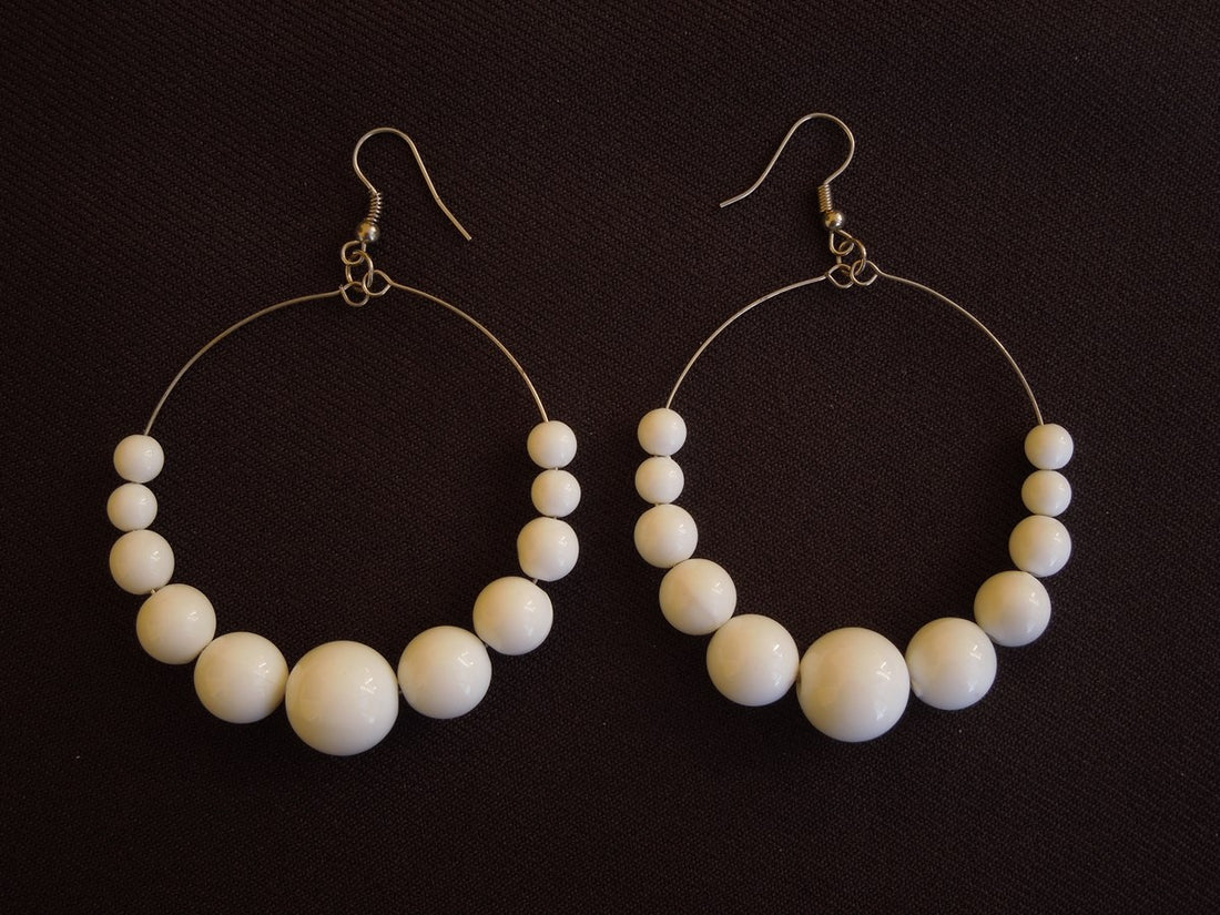 Graduated white beads on silver round wire 3.25" long incl ear wire