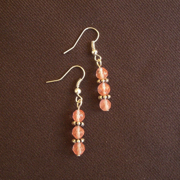 Earrings made of Small faceted cherry quartz rounds with silver accents