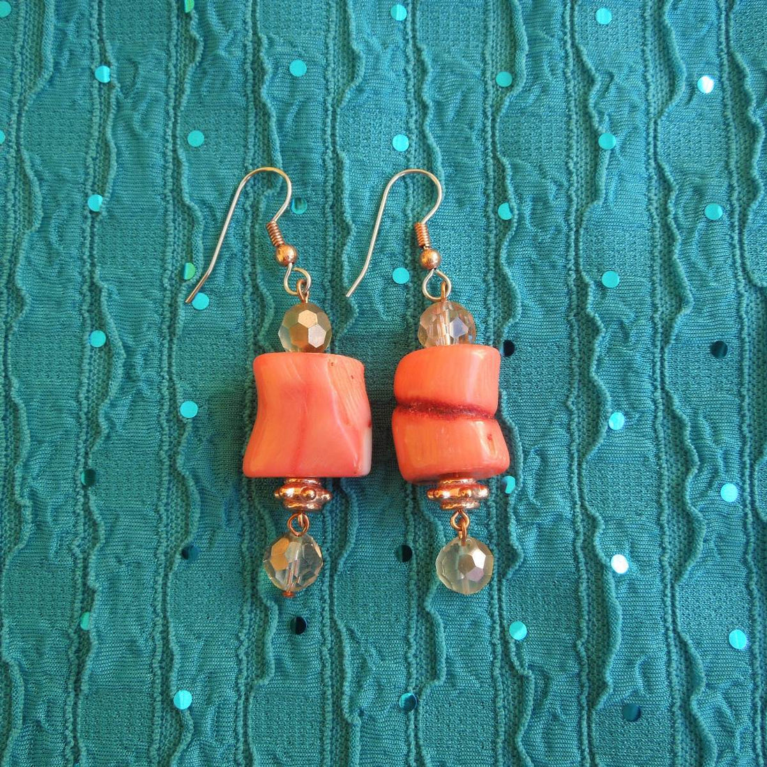 Earrings made of Peach coral Barrels with copper crystals