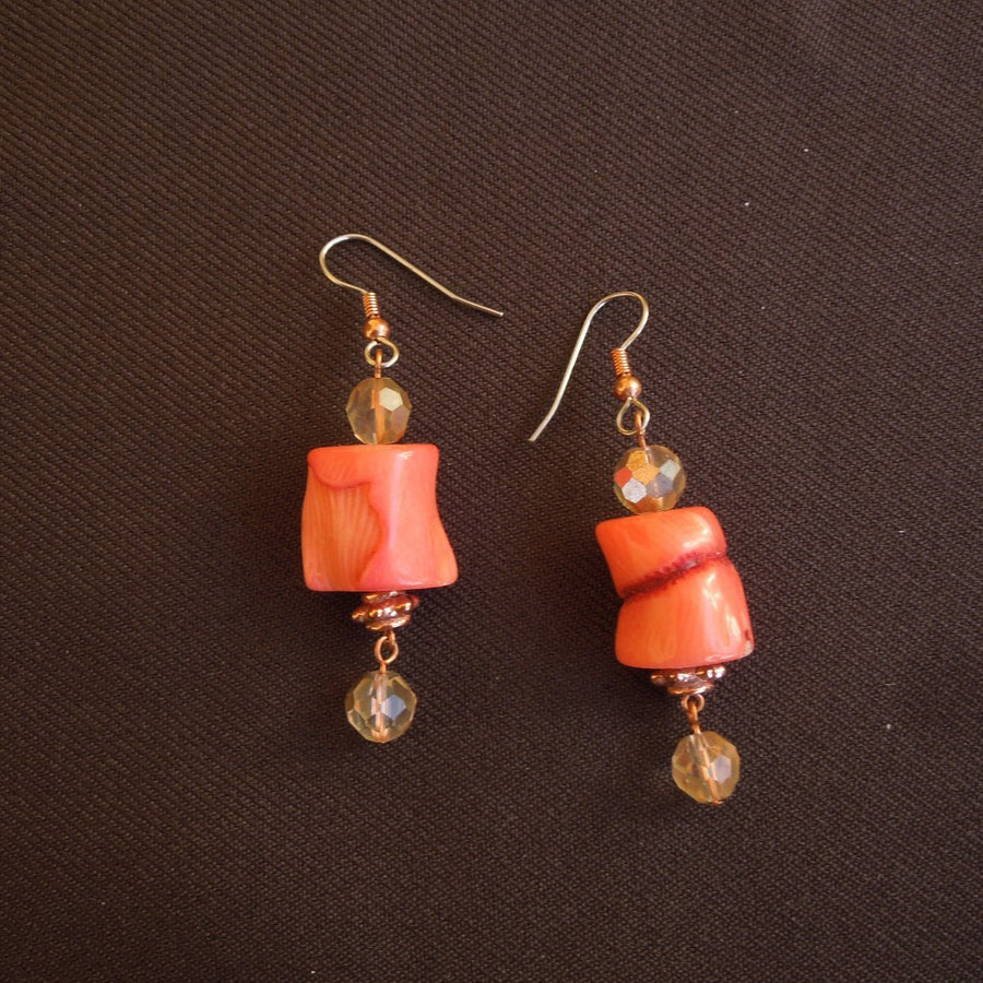 Earrings made of Peach coral Barrels with copper crystals