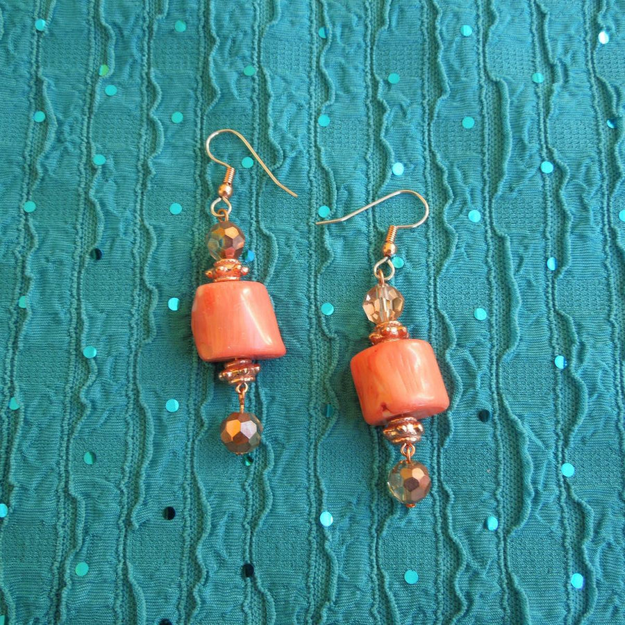 Earrings made of Peach coral Barrels with copper crystals