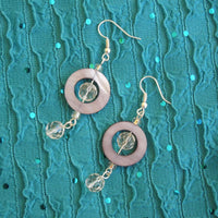 Earrings made of Grey Shell donut beads with clear crystals