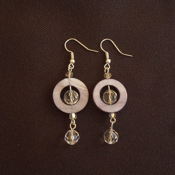 Earrings made of Grey Shell donut beads with clear crystals