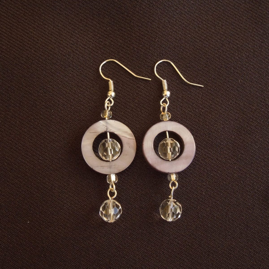 Earrings made of Grey Shell donut beads with clear crystals