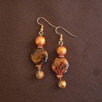 Earrings made of Black & copper coin beads with copper florentine & crystal