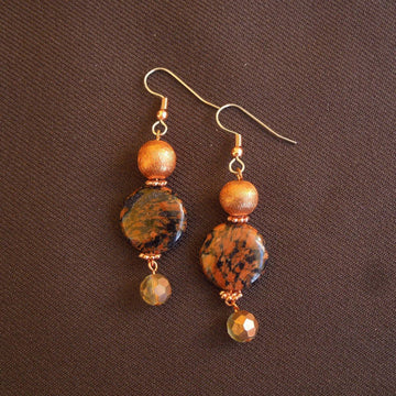 Earrings made of Black & copper coin beads with copper florentine & crystal