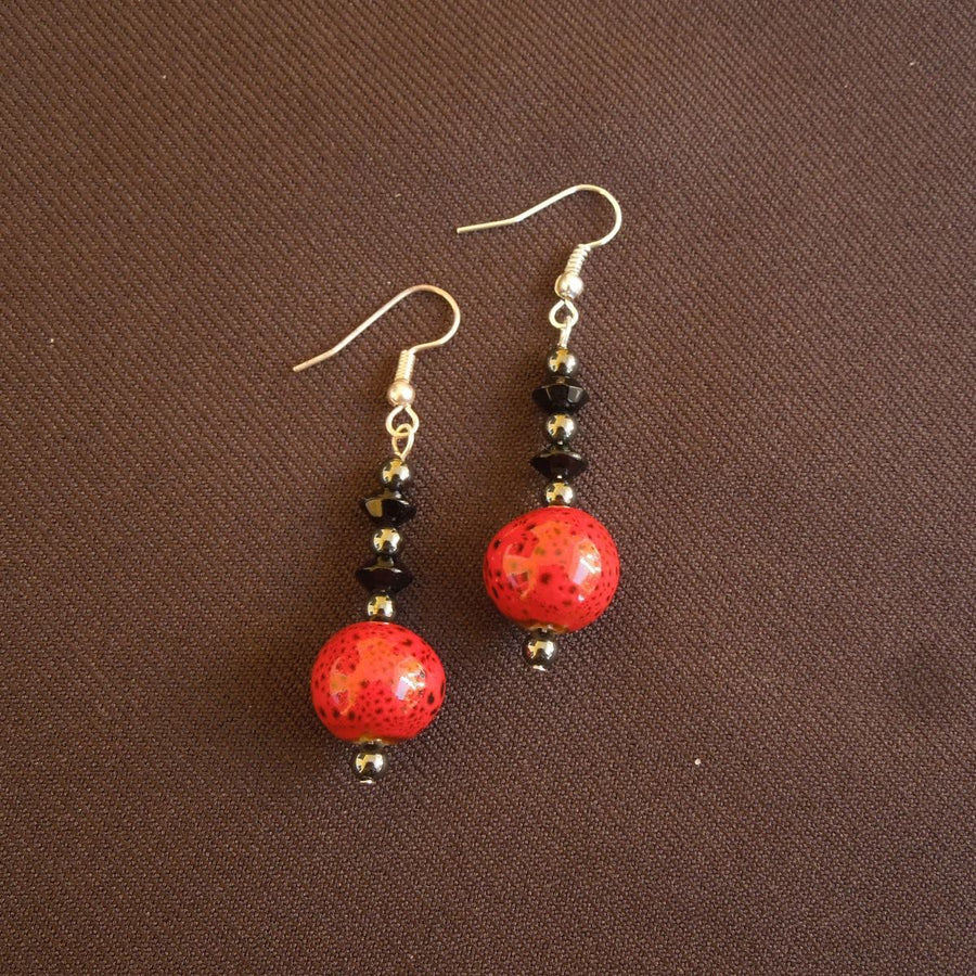 Earrings made of Round red & black bead with black rondels & round hematite