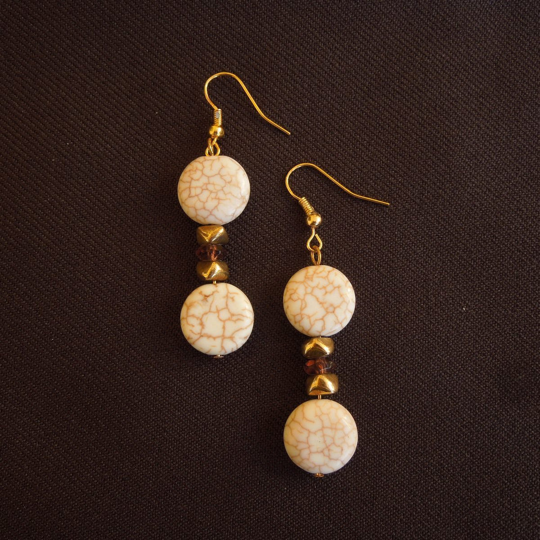 Earrings made of Natural Magnesite coin beads with gold accents