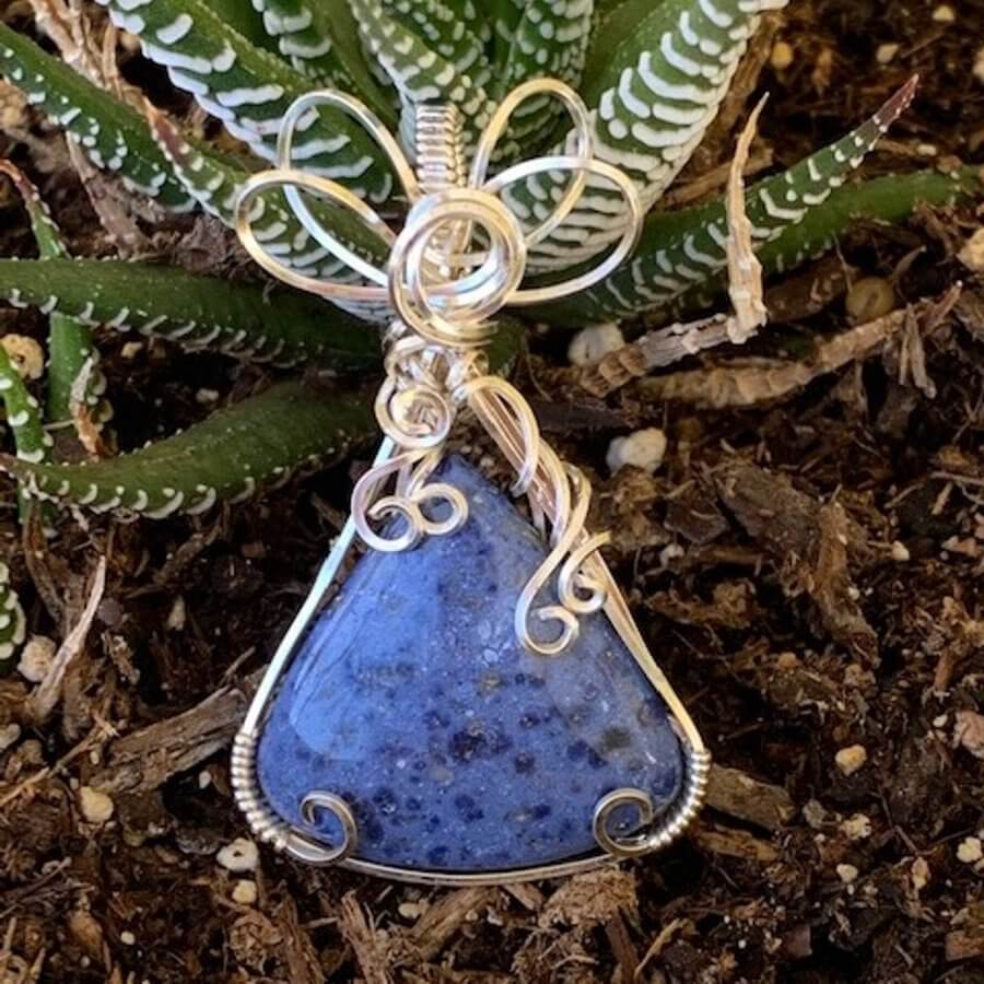 Pendant made of Dumortierite Triangle with silver wrap; 1.25" w x 2" h, incl bail