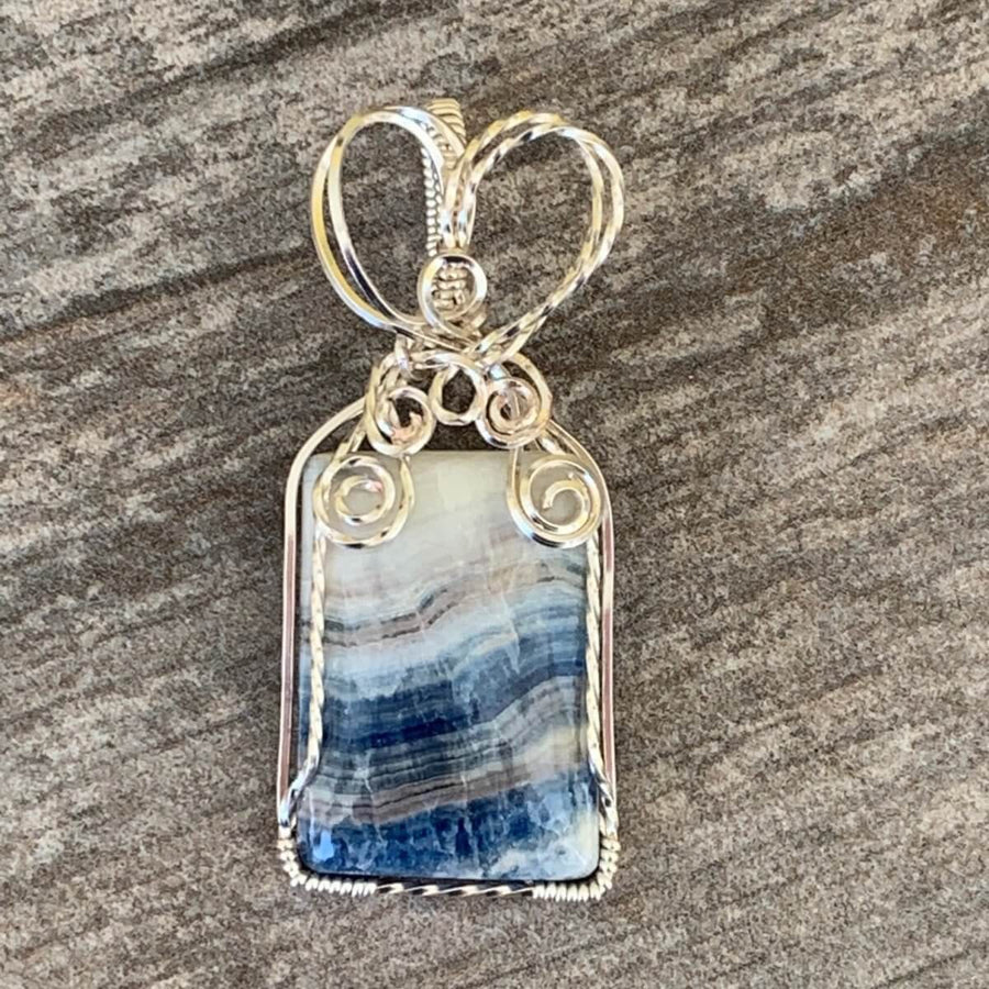 Pendant made of Stichtite Square blue & white stone with silver wire wrap; 1" w x 2.25" l, incl bail