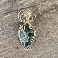 Pendant made of Natural Seraphinite Teardrop stone with Silver wire wrap; 1" w x 2 1/8" long, incl bail