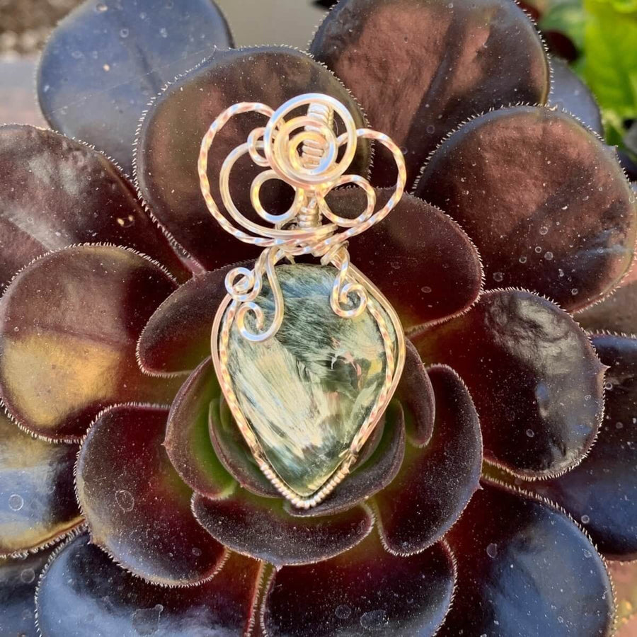 Pendant made of Natural Seraphinite Teardrop stone with Silver wire wrap; 1" w x 2 1/8" long, incl bail