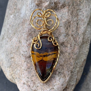 Pendant made of Natural Desert Jasper Teardrop stone with gold wire wrap; 7/8" w x 2" long, incl bail