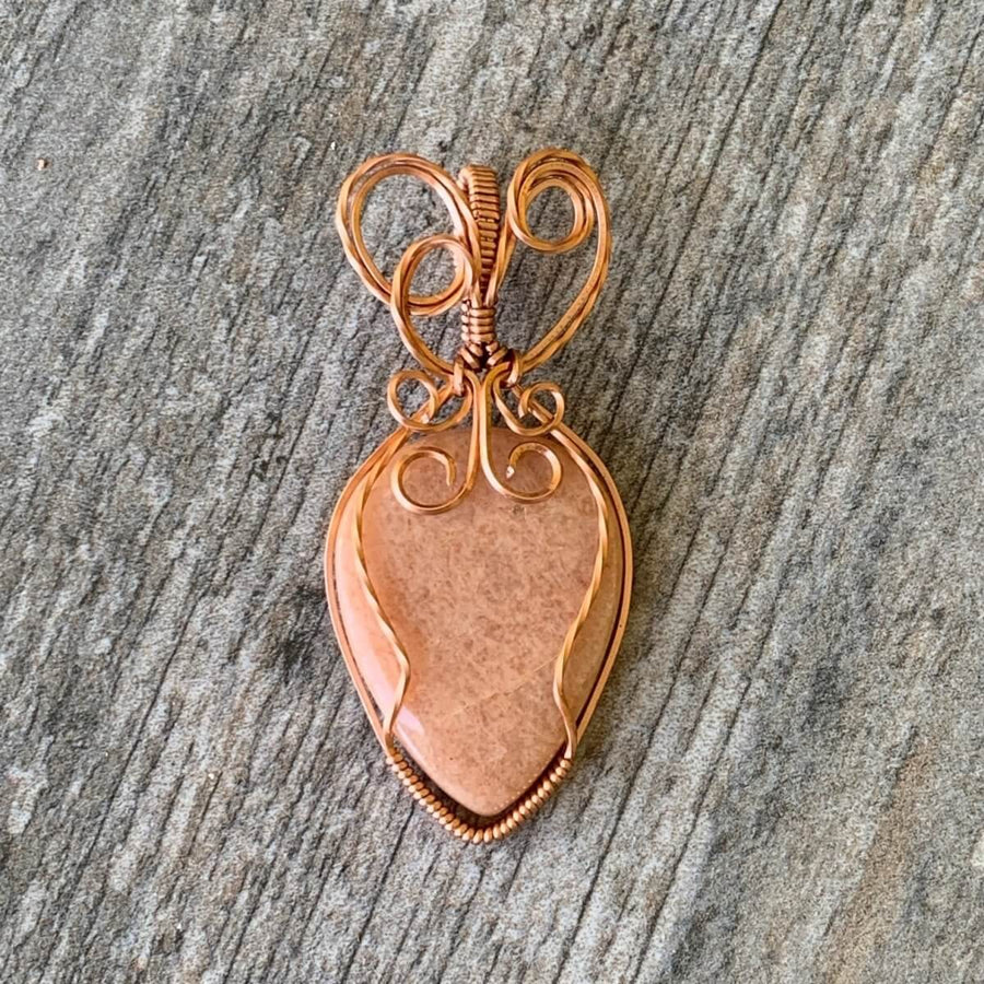 Pendant made of Peach Amazonite Teardrop stone with copper wire wrap; 1" w x 2 3/8" long, incl bail
