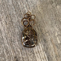 Pendant made of Turritella Square Agate with Bronze wire wrap; 7/8" w x 2" long, incl bail