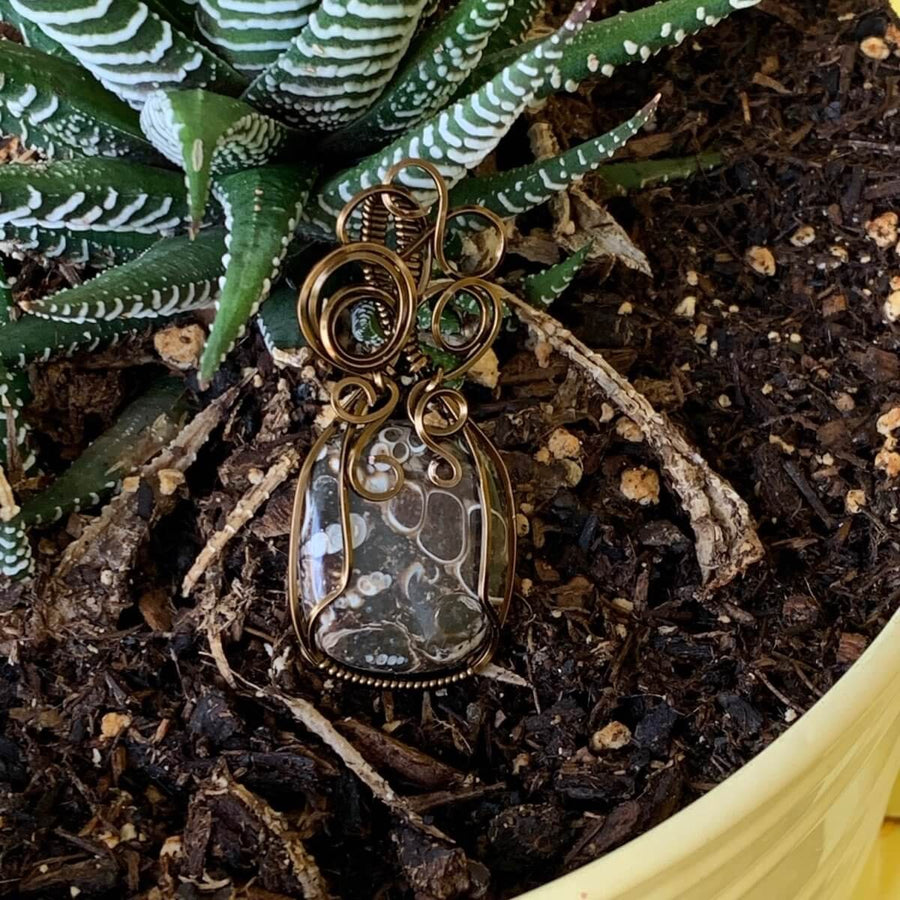 Pendant made of Turritella Square Agate with Bronze wire wrap; 7/8" w x 2" long, incl bail