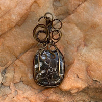 Pendant made of Turritella Square Agate with Bronze wire wrap; 7/8" w x 2" long, incl bail