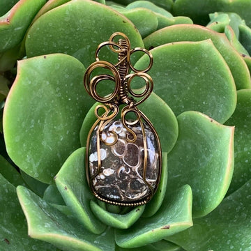 Pendant made of Turritella Square Agate with Bronze wire wrap; 7/8" w x 2" long, incl bail