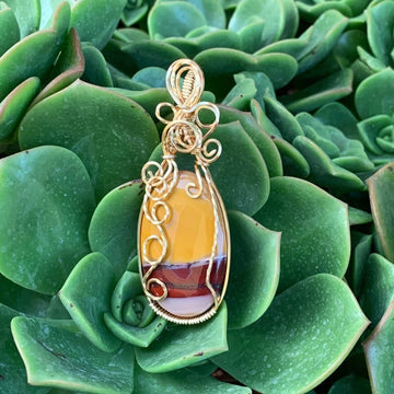 Pendant made of Mookaite Oval with gold wire wrap; 1"w x 25/8" long, incl bail