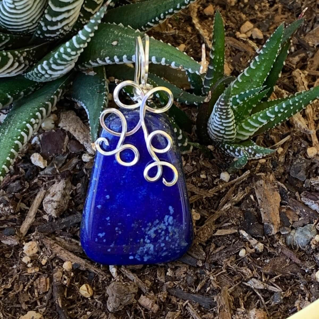 Pendant made of Lapis Lazuli Triangular Nugget with Silver wire wrap; 1" w x 2" long incl bail