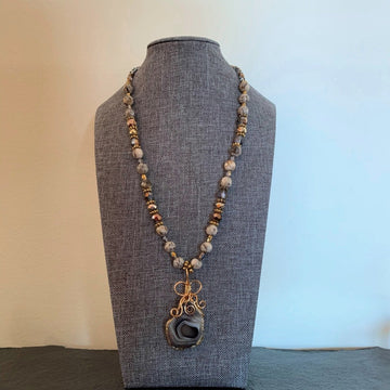 A necklace made of Grey Botswana Agate trimmed in gold with Jasper beads and crystals