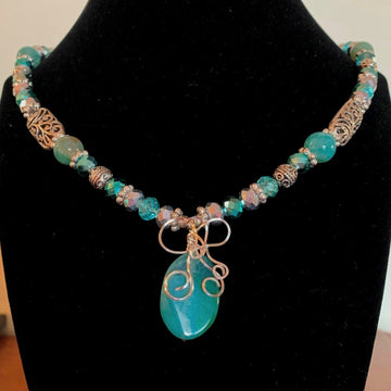 A necklace made of Aqua Fire Agates w/Silver & Turquoise crystals