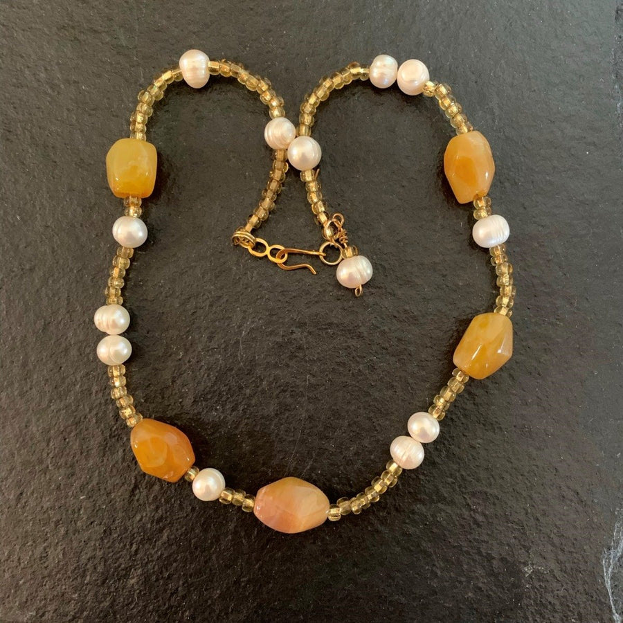 A necklace made of Honey opals with fresh water pearls & seed beads