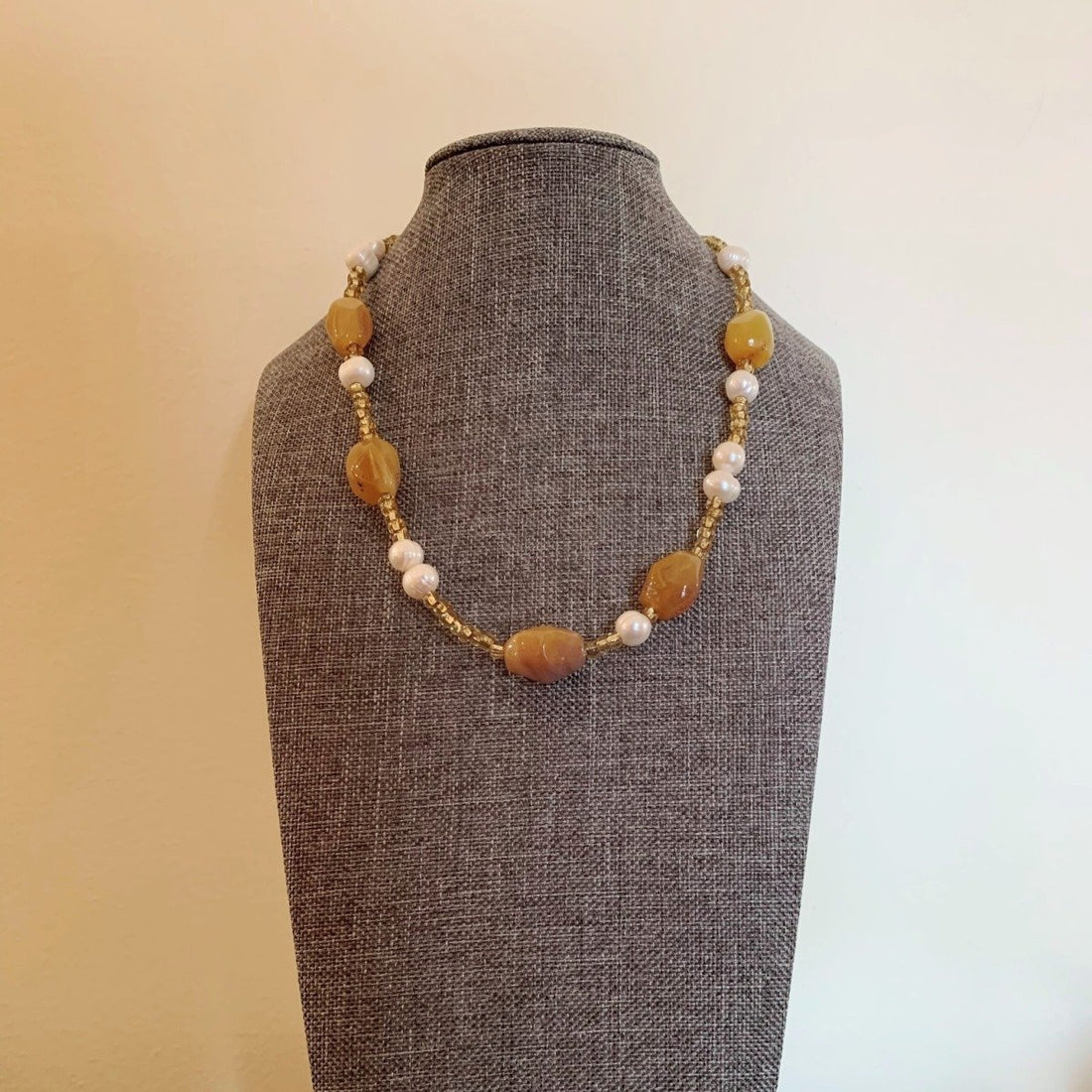 A necklace made of Honey opals with fresh water pearls & seed beads