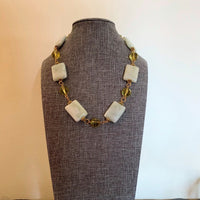 A necklace made of Harmony Jasper rectangles with Green crystals on gold chain