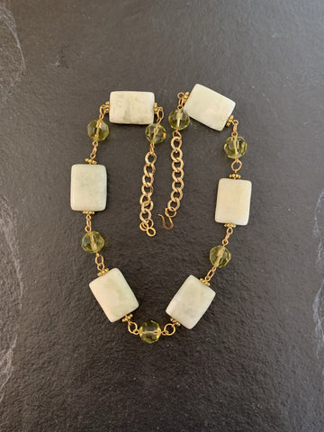 A necklace made of Harmony Jasper rectangles with Green crystals on gold chain