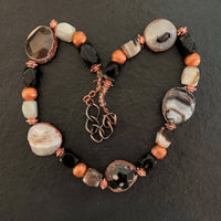 A necklace made of Agate Nuggets with rough edges, black & white rectangle agates and Copper beads