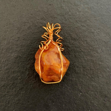 Pendant made of Large freeform Orange Carnelian w/ gold wrap; 1.5" x 2.5" incl bail