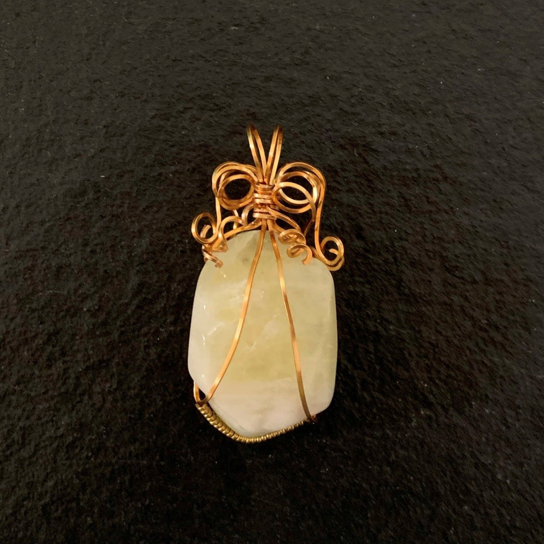 Pendant made of Pale Yellow Heliodore Golden Beryl stone w/gold wrap; 1" x 2.3" incl bail