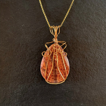 Pendant made of Large Oval Orange Fire Agate w/gold wrap; 1.5" x 3" incl bail