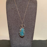 Pendant made of Turquoise Oval Fuchsite Stone w/ silver wrap; 1" x 2.25" incl bail