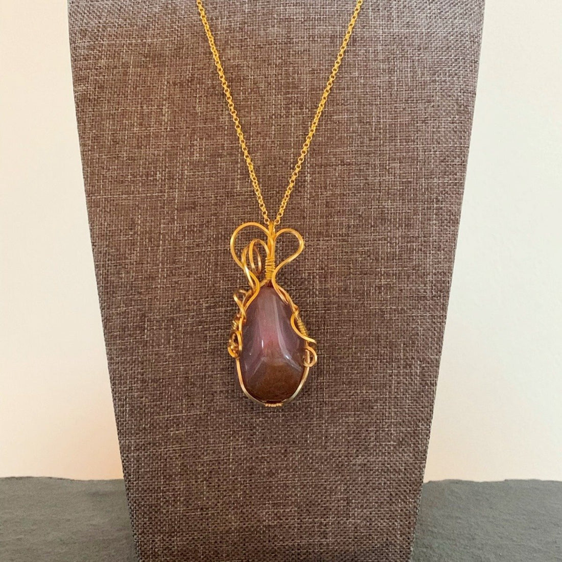 Pendant made of Purple Chalcedony free form with gold wire 1" w x 2 3/8" h incl bail